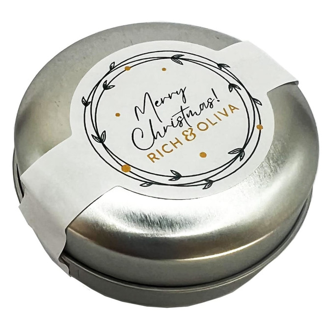 A silver tin featuring a festive label, containing chewy mints, elegantly designed for Christmas.