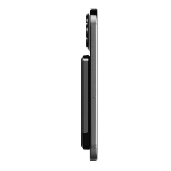 A black magnetic wireless power bank positioned alongside a smartphone, showing a slim profile.
