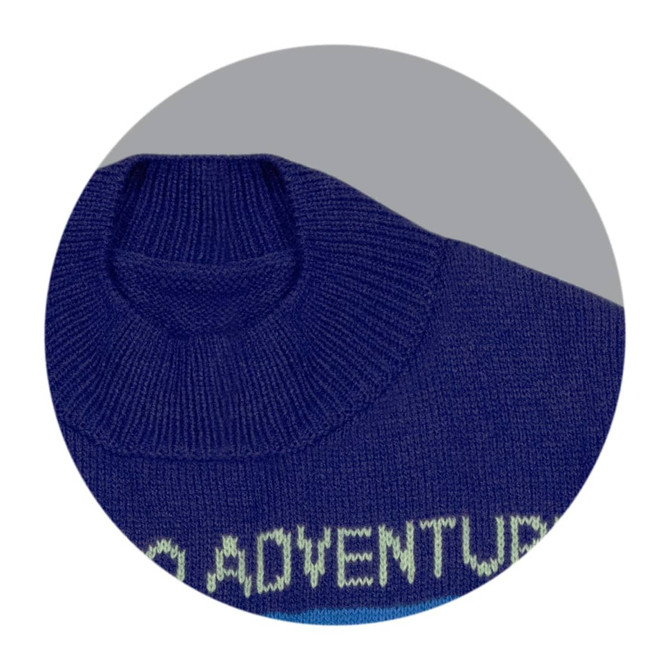 A knitted jumper in navy blue with a high neckline and ribbed collar, featuring a design on the front.