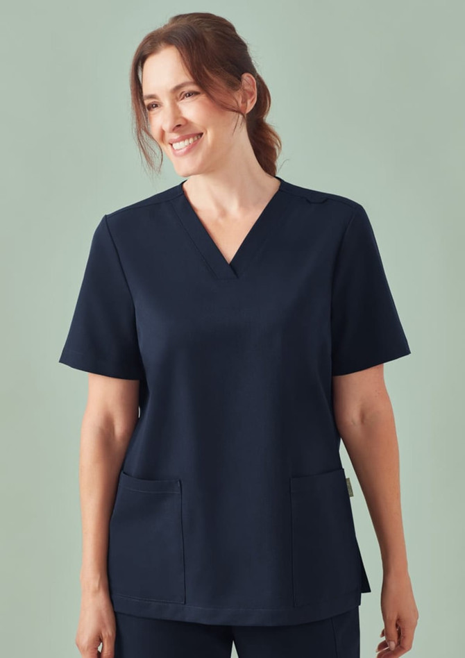 A women's navy V-neck scrub top featuring short sleeves and two front pockets. It has a subtle logo.