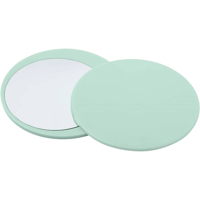 A mint green circular makeup mirror with a reflective surface and a smooth outer edge.