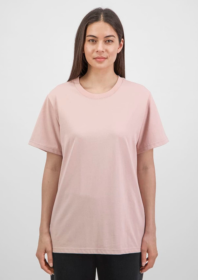 A women's short sleeve tee in soft pink, featuring a classic fit and a logo on the chest.