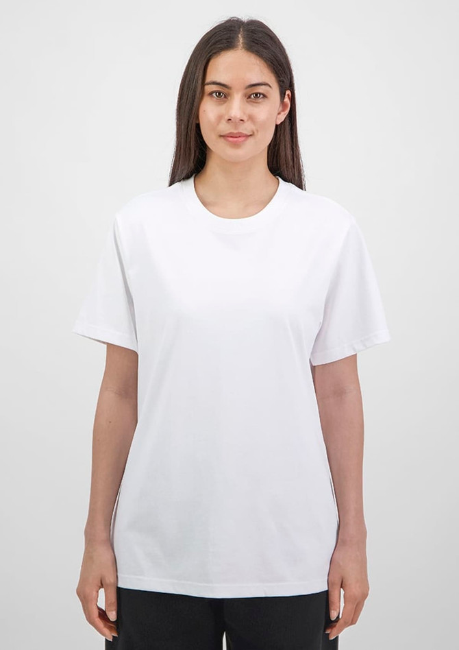 A white women's short sleeve tee is displayed on a model against a neutral background. The shirt has a relaxed fit.