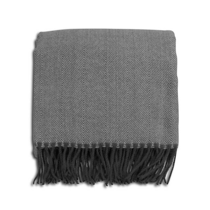 A grey herringbone throw blanket with fringe detailing, neatly folded. It has a subtle pattern and a soft texture.