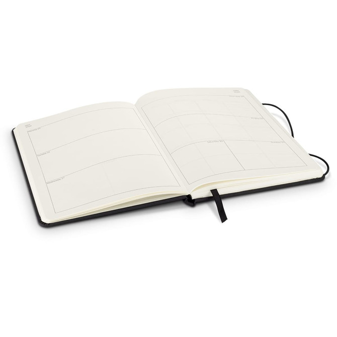 A black weekly diary for 2026, open to reveal blank, lined pages with a ribbon bookmark.
