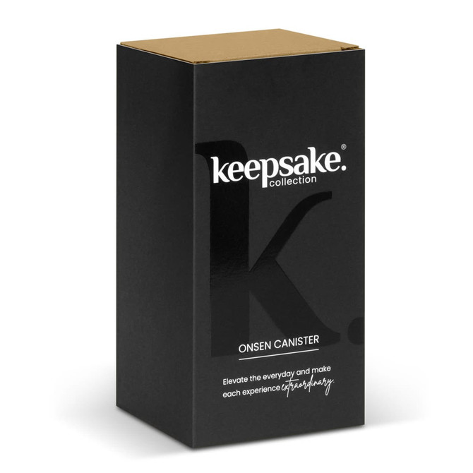 A black canister with a gold lid, featuring a logo and packaging for the Keepsake Onsen Canister.