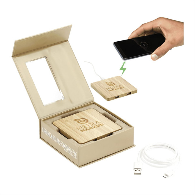 A bamboo wireless charging pad with dual outputs, presented in a box, alongside a charging cable.