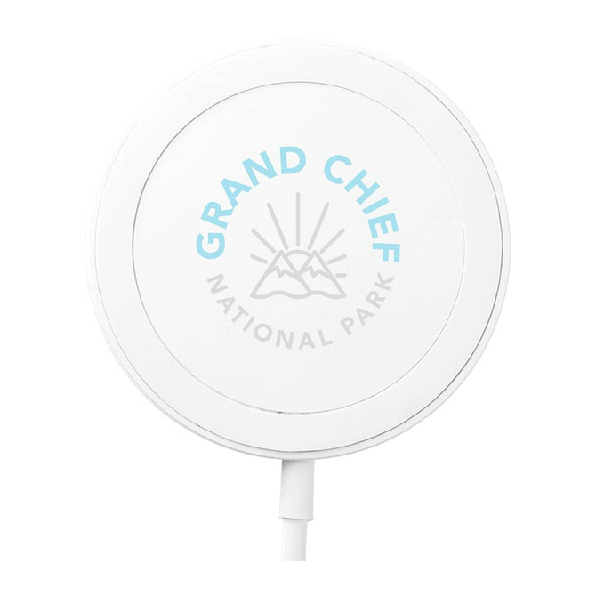 A white wireless charging pad with a circular design and a logo featuring mountains and text.