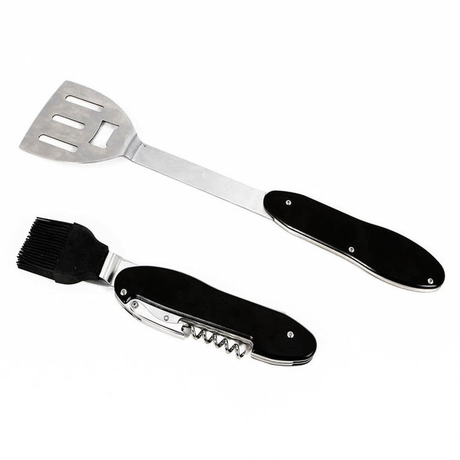 A BBQ multi tool featuring a stainless steel spatula and a brush, with black handles. Includes a bottle opener.