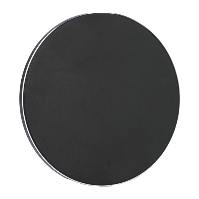A black, round wireless charging pad made from recycled aluminium, featuring a subtle branding logo.