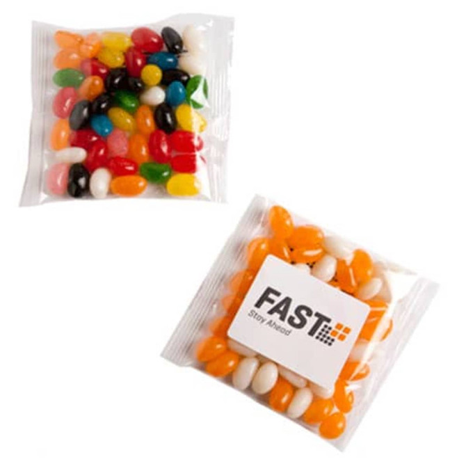 A clear bag containing assorted jelly beans in various colours, featuring a branded sticker on the front.