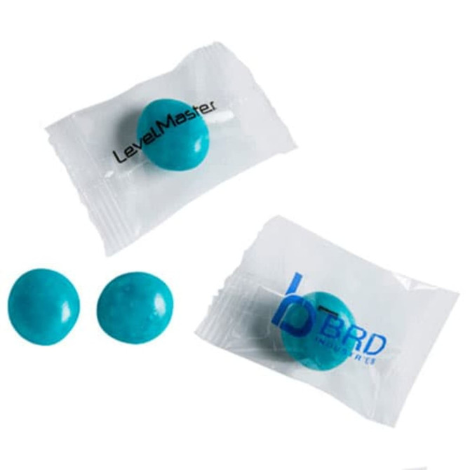 Individually wrapped blue chewy fruit candies in unbranded packaging, with two candies displayed in front.