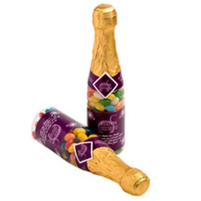 A drink bottle filled with colourful jelly beans, featuring a gold foil neck and decorative branding on the body.