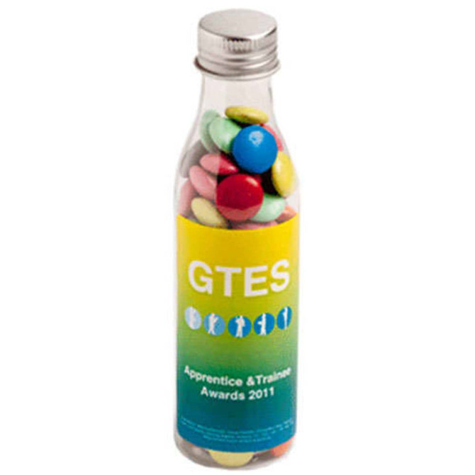 A drink bottle filled with colourful chocolate beans, featuring a branded sticker on the bottle.