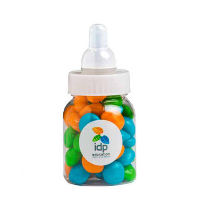 A drink bottle filled with chewy fruit in blue, green, orange, and other vibrant colours. It has a logo on the front.