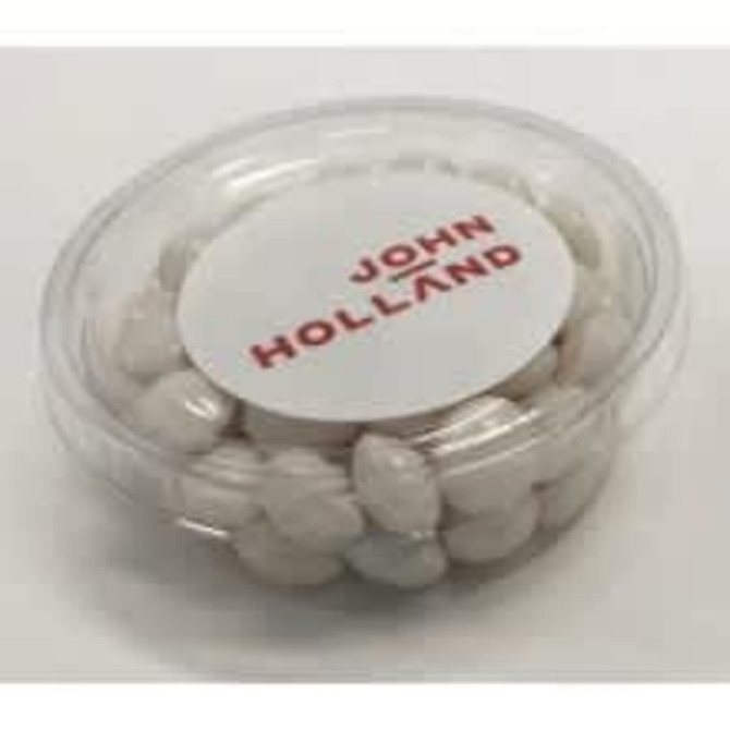 A clear tub filled with white mints. The tub features a branding label on the top.