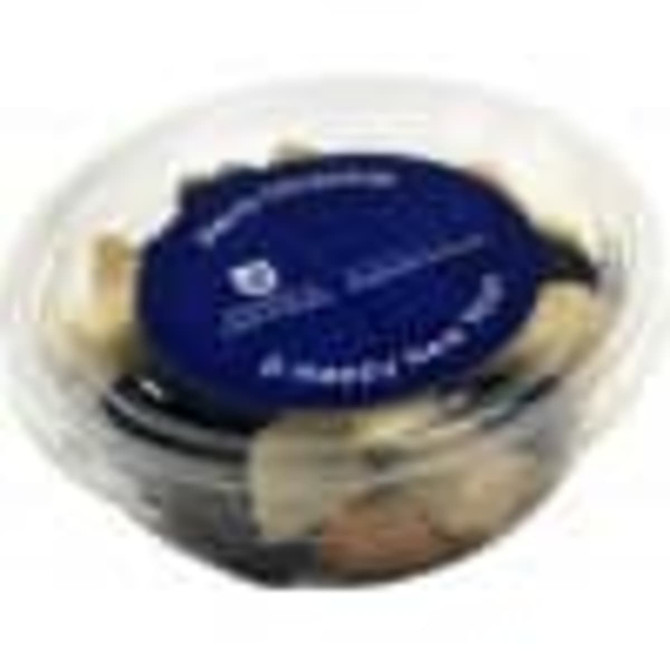 A tub filled with a mix of fruit and nuts, featuring dark and light nuts, with a clear lid and a blue label.