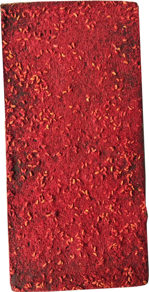 A chocolate bar featuring dried raspberries, predominantly red with flecks, on a dark chocolate base.