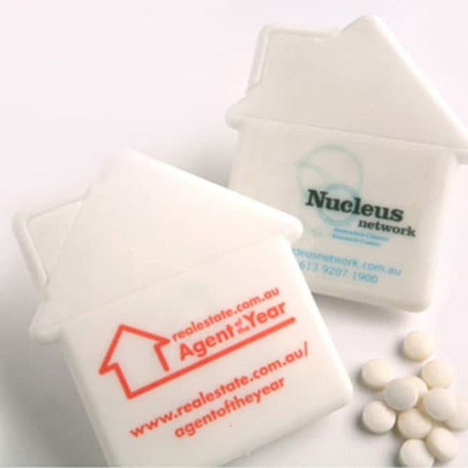 A house-shaped mint card in white, accompanied by small white sugar-free mints. The card features unbranded elements.