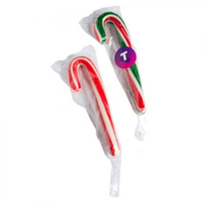 Two large candy canes in red, white, and green packaging, featuring a circular logo on one.
