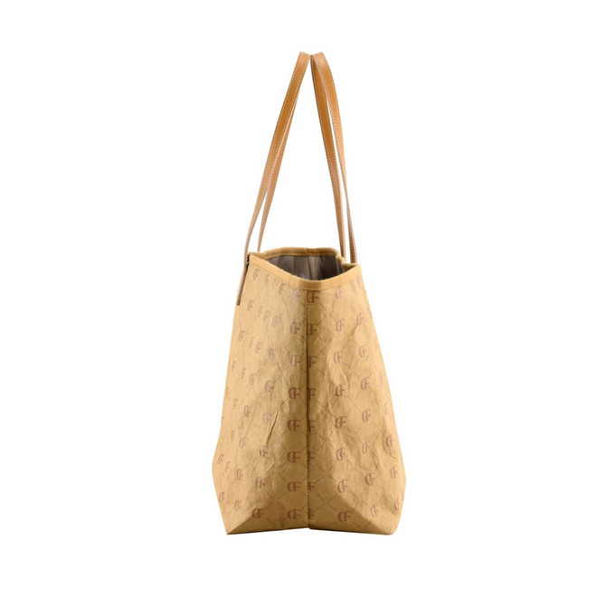 A yellow Kraft paper tote bag with long handles and a logo pattern throughout.
