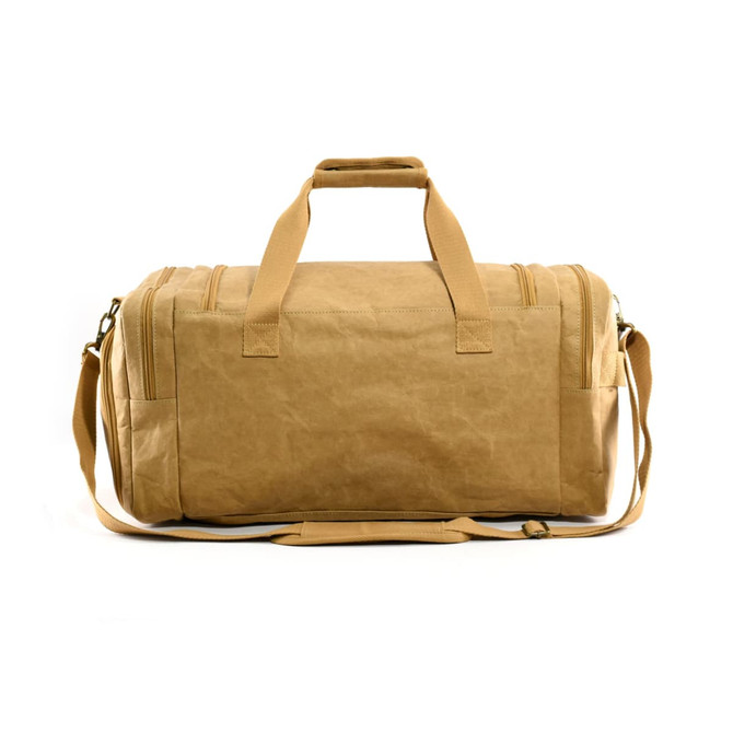 A tan kraft paper duffle bag with carry handles and an adjustable shoulder strap. It has a logo on the side.