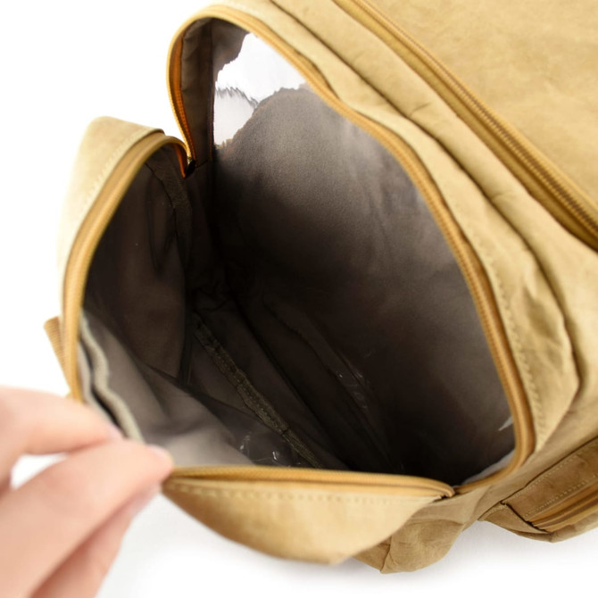 A tan Kraft paper duffle bag with a spacious interior and a zippered opening. It includes a logo.