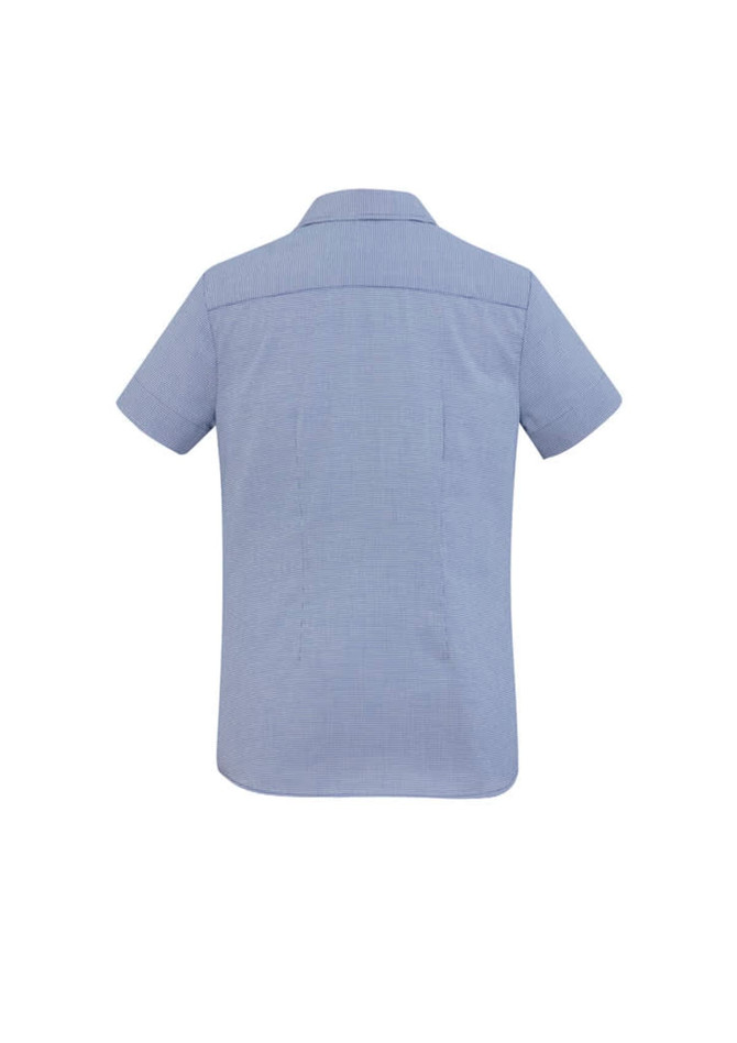A short sleeve women's button-up shirt in a light blue fabric, featuring a subtle pattern and a back yoke.