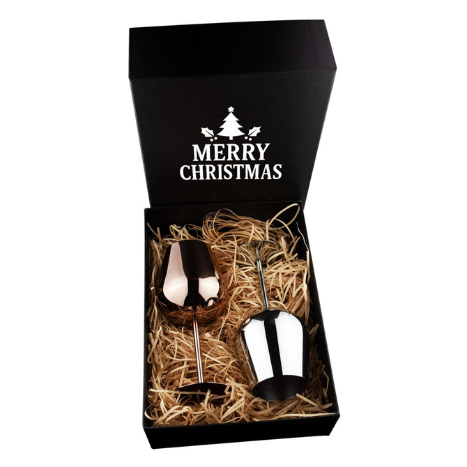 A stainless steel wine glass gift set in a black box, featuring a rose gold and silver glass, with festive straw filling.