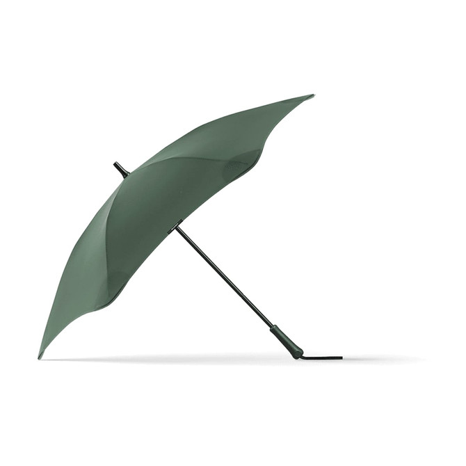 A green BLUNT Classic Umbrella with a sleek design, featuring a curved canopy and sturdy black frame.