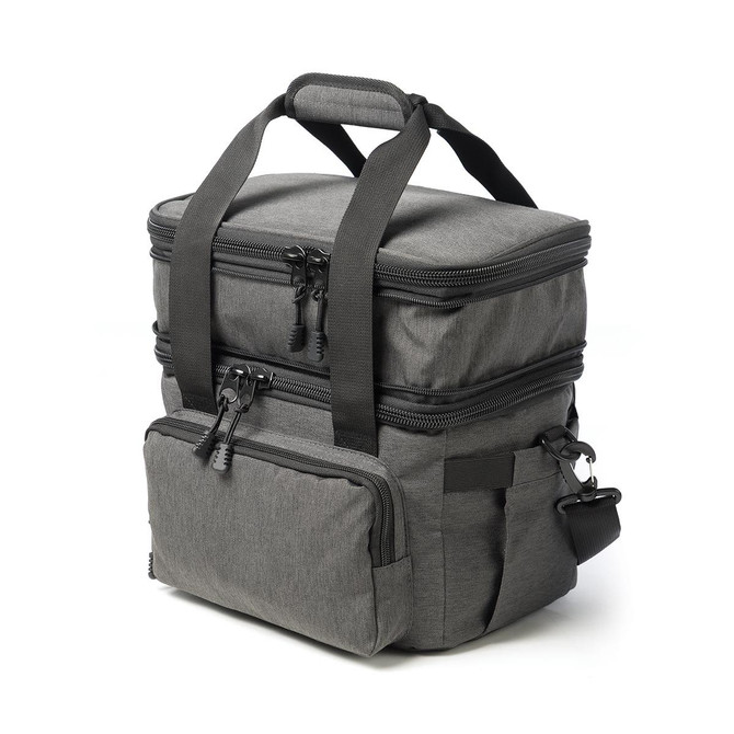 A grey expanding cooler bag with dual compartments, featuring zippers and a sturdy handle for easy transport.