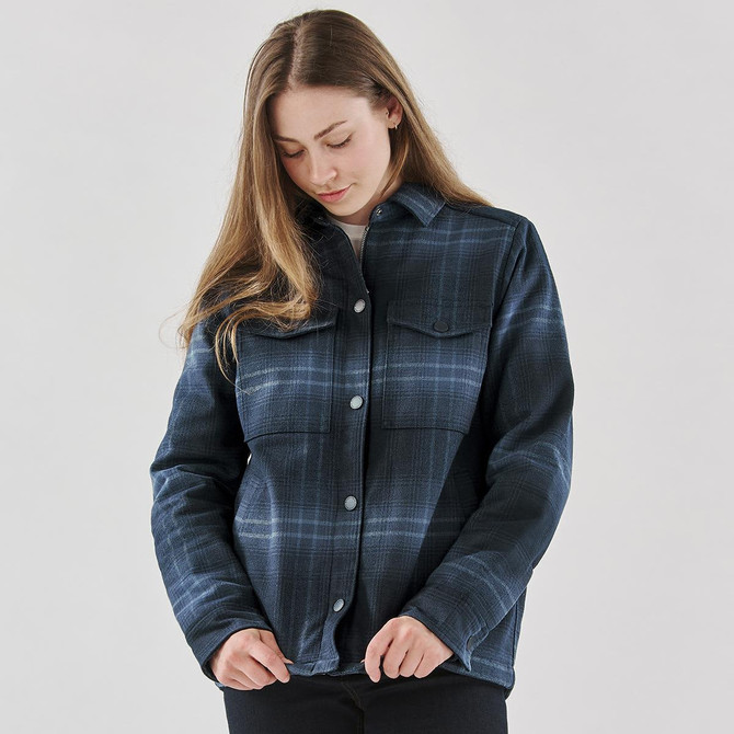 A women's plaid jacket in navy with a sherpa lining and button front, featuring two chest pockets.