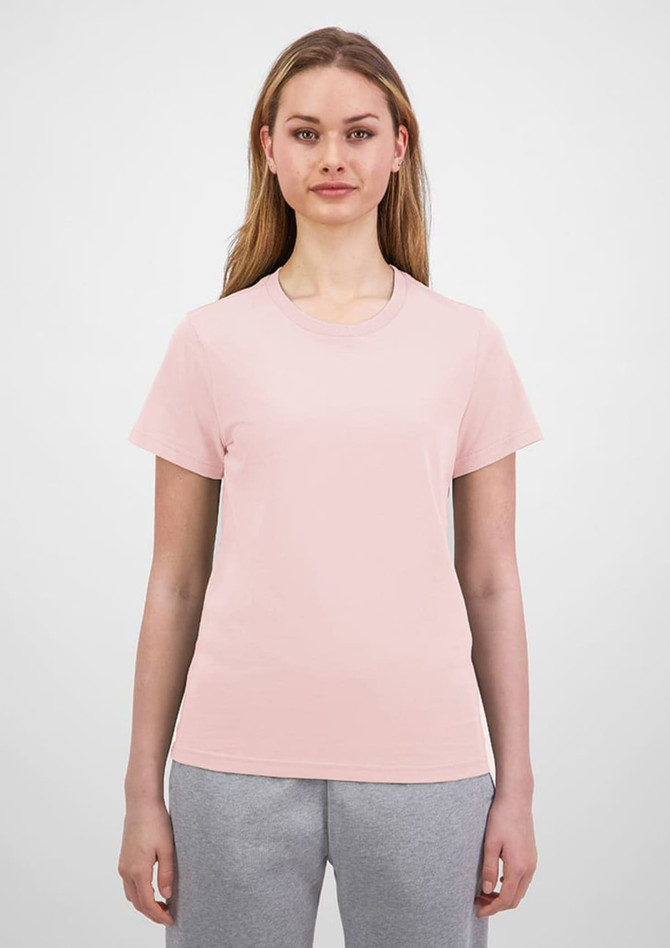 A light pink women's short sleeve tee with a fitted design, featuring a logo on the front.