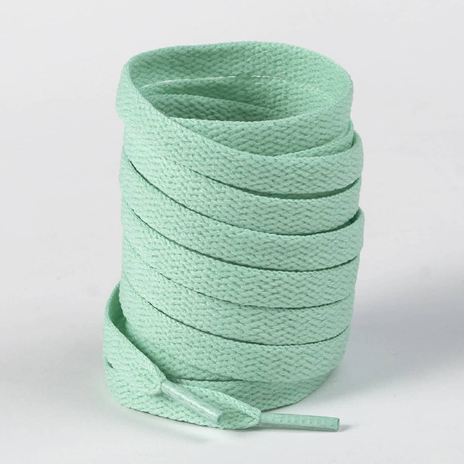 A spool of light mint green shoelaces, neatly coiled and ready for use. The product has a simple design.