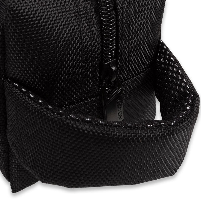 A black toiletry bag featuring a zippered compartment and an exterior pocket. The fabric has a textured finish.