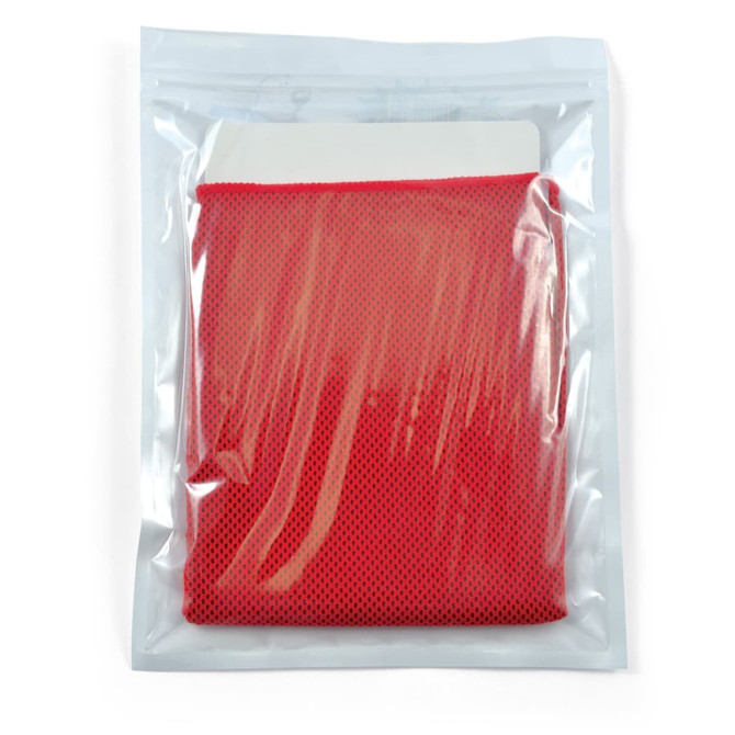 A red cooling towel packed in a clear, sealed pouch with a logo on the front.