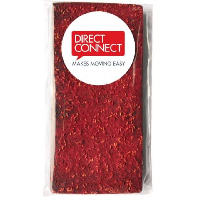 A red package containing dried raspberries coated in chocolate, with a logo present on the front.