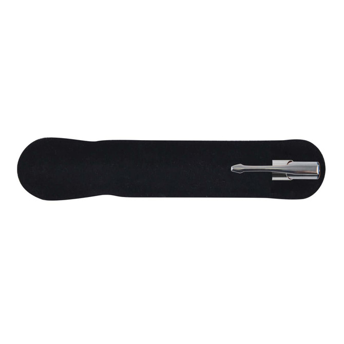 A silver metal pen rests on a black velvet holder, showcasing its sleek design.
