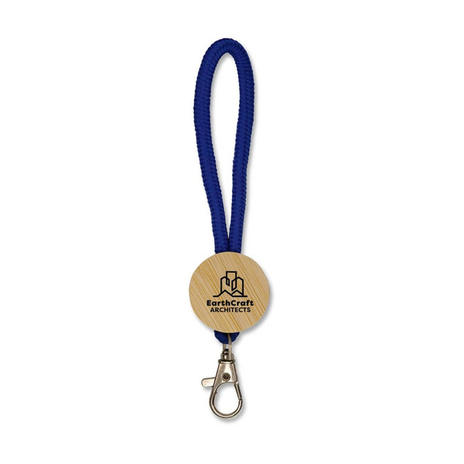 A blue keytag with a wooden circular attachment featuring a logo and a metal clip.