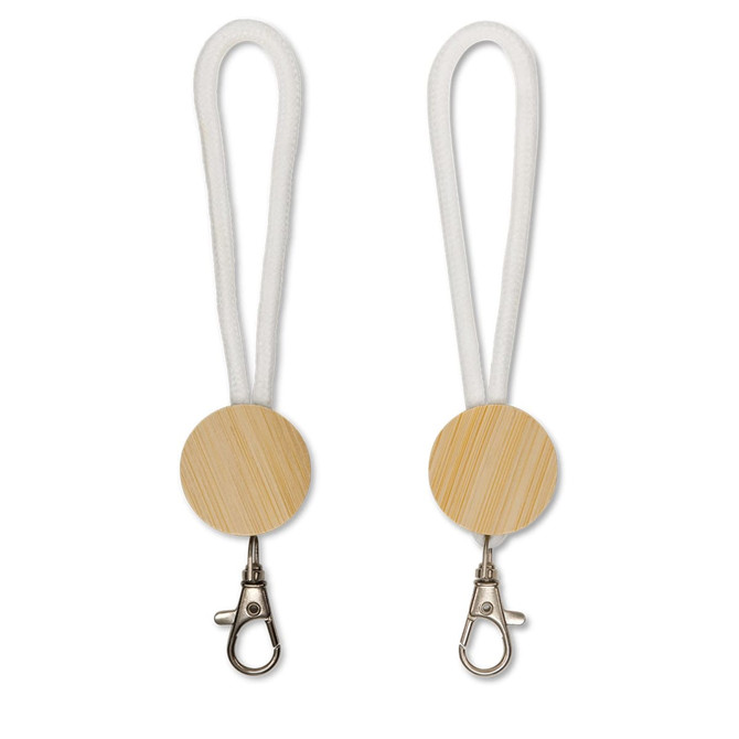 A bamboo keytag with a white loop and silver clasp, designed for easy attachment and carry.