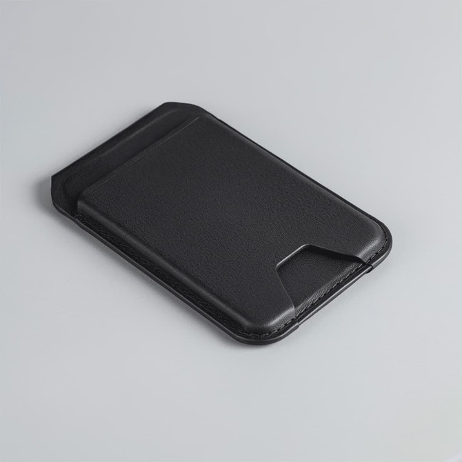 A black magnetic wallet with a slim design, featuring a phone stand and a branding logo on the surface.