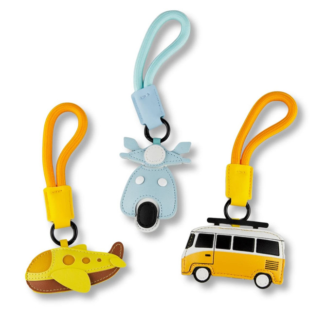 Three bag charms in yellow, blue, and orange featuring an airplane, a reindeer, and a vintage van.