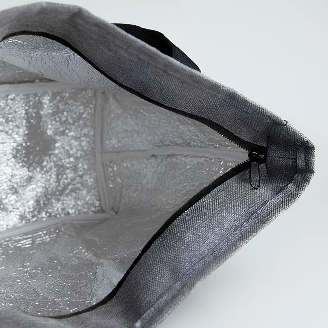 A grey lunch bag with a silver insulated interior and a zip closure, featuring a black handle.