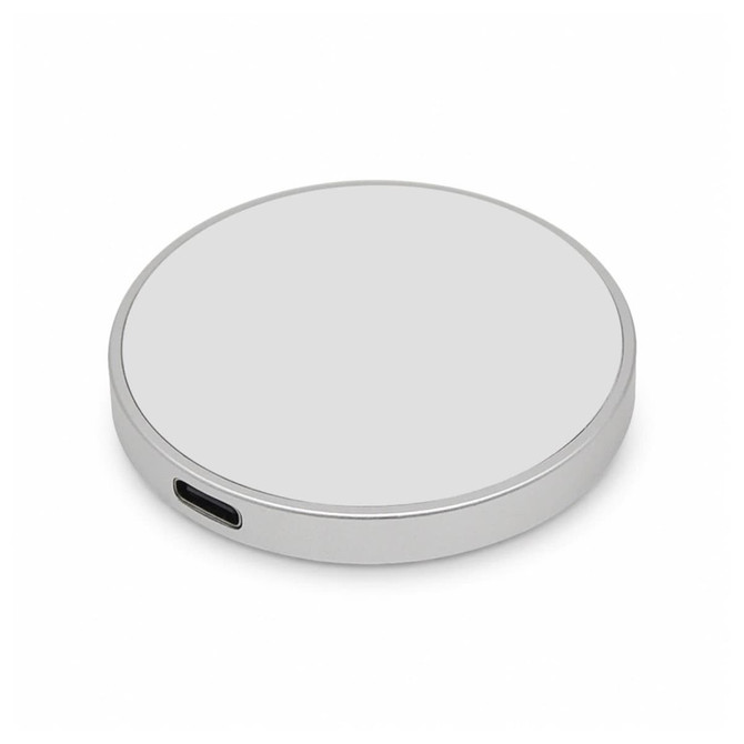 A silver circular wireless charger with a USB-C port, featuring a smooth surface and simple design.