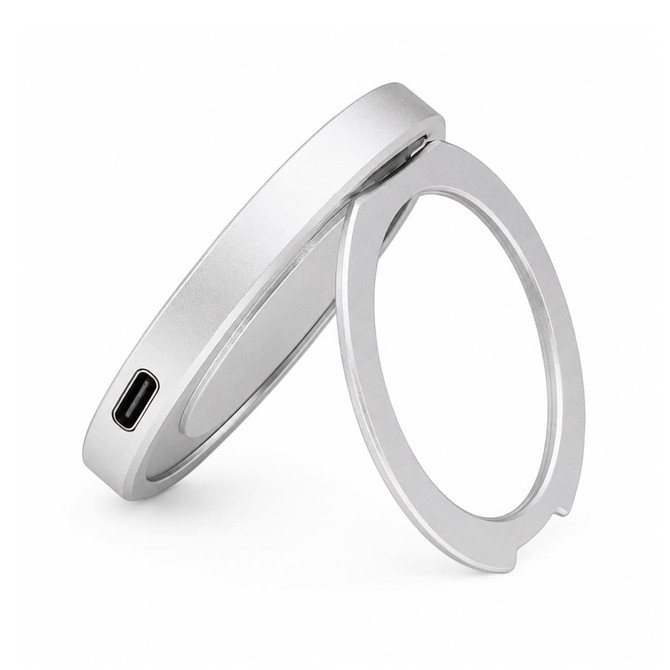 A magnetic phone and watch charger with a stand, featuring a sleek silver design and a USB-C port.