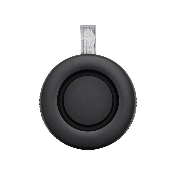 A black portable speaker with a grey strap, featuring a circular design and textured surface.