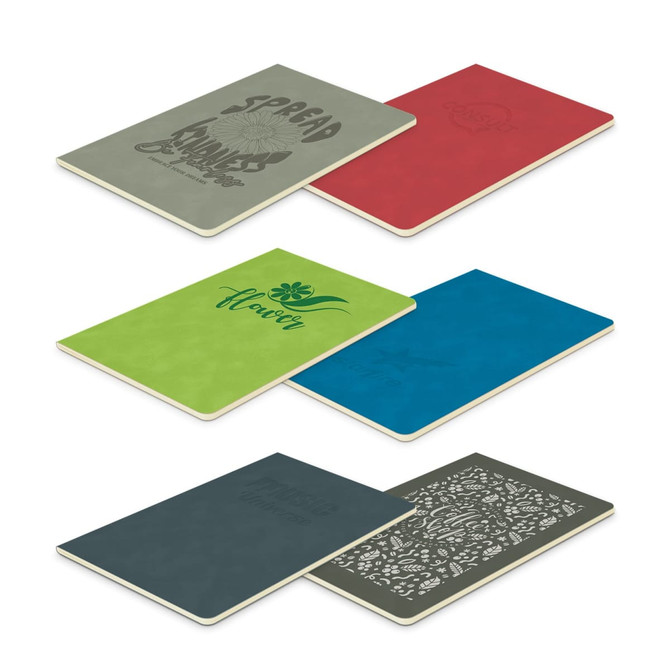 A set of notebooks in green, red, blue, and dark grey featuring various designs and a logo on the covers.