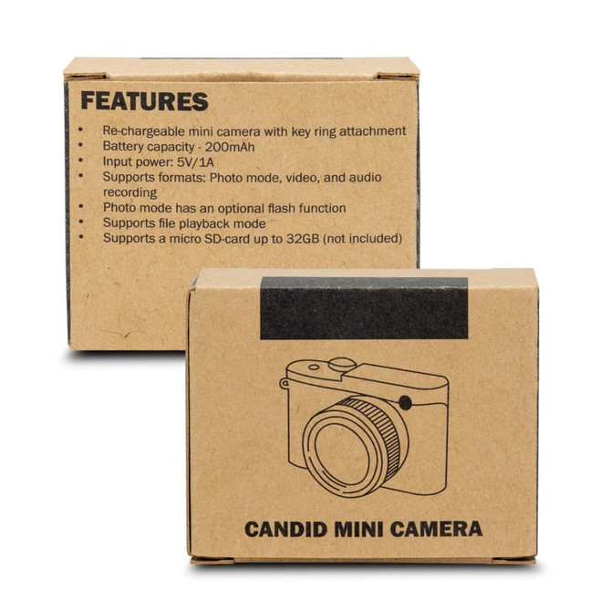 A brown cardboard box containing a Candid Mini Camera with a key ring attachment. It features a camera graphic on the front.