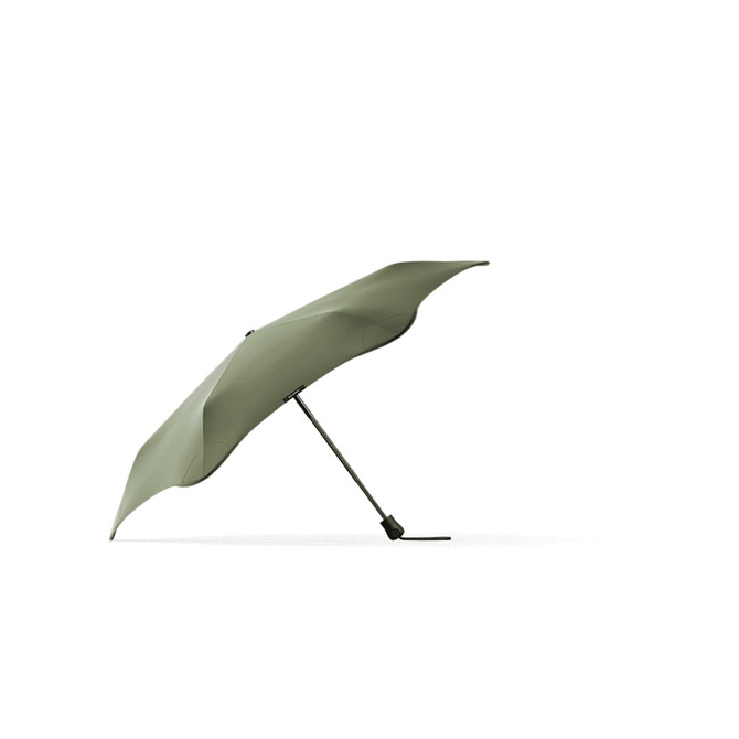 A green Blunt Neo umbrella with a sleek design and a metallic handle, featuring a logo on the fabric.