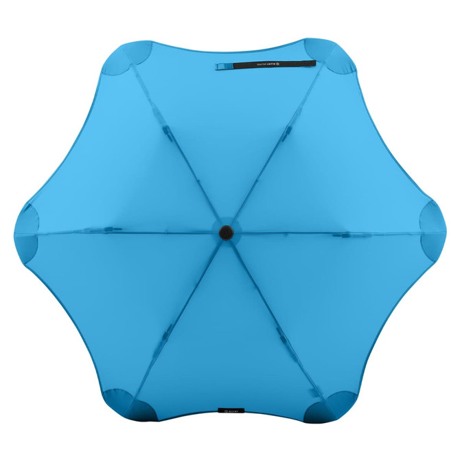 A blue BLUNT Metro Umbrella featuring a unique, aerodynamic design and a central black button.